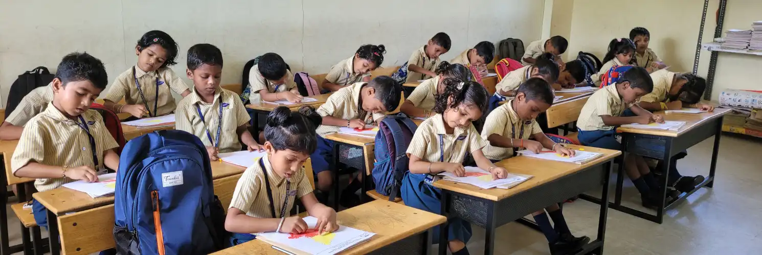 Students studying in Gravity English Medium School classroom